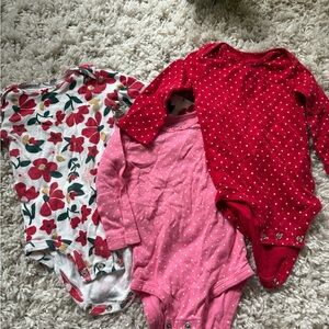 Vibrant Red and Pink Long-Sleeve Bodysuits with Floral and Polka Dot Designs